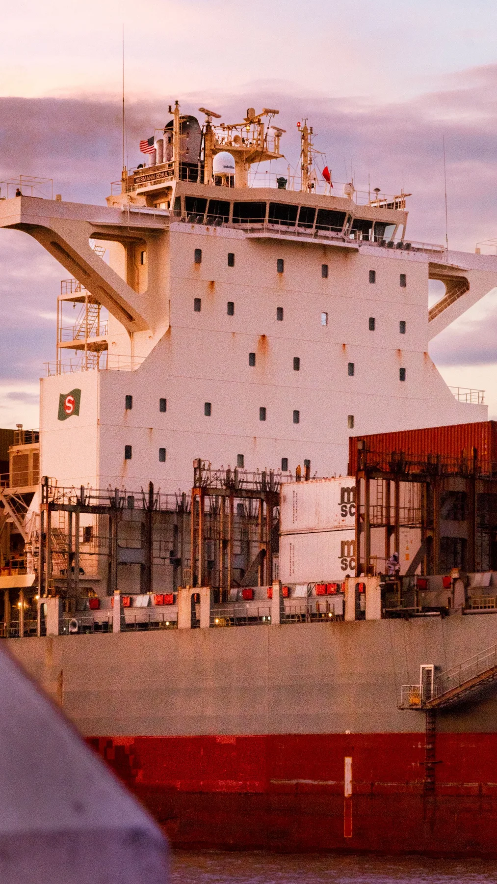 Cargo vessel and stacked containers; international freight reference