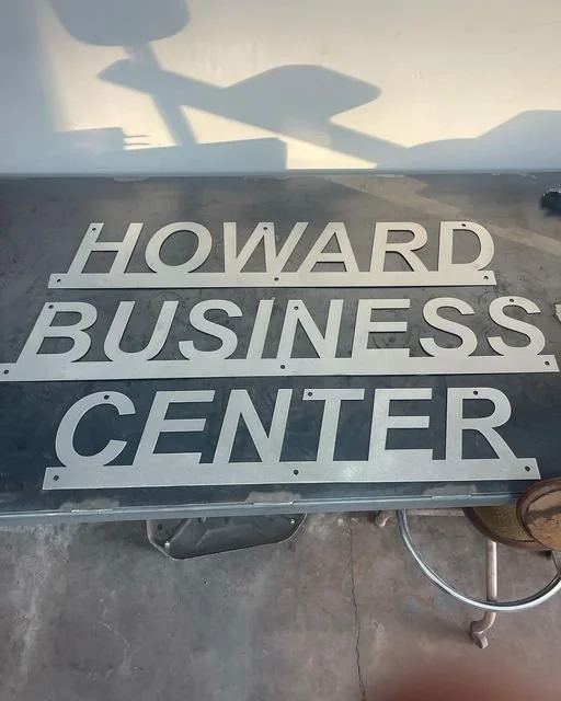 Cut metal letters and mounting holes arranged before installation; application reference