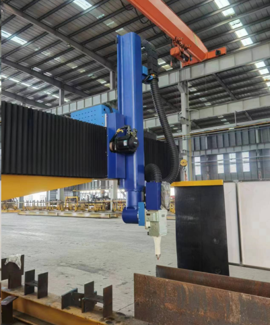Third-party photograph of a gantry laser cutting head beside an H-beam on a support bed