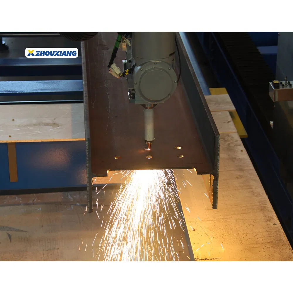 Third-party reference photograph of laser piercing an H-beam web with sparks beneath the beam