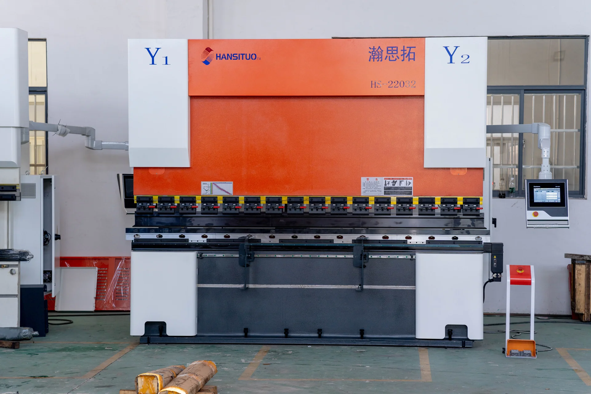 Front view of an orange and white HANSITUO CNC press brake with a side control panel.