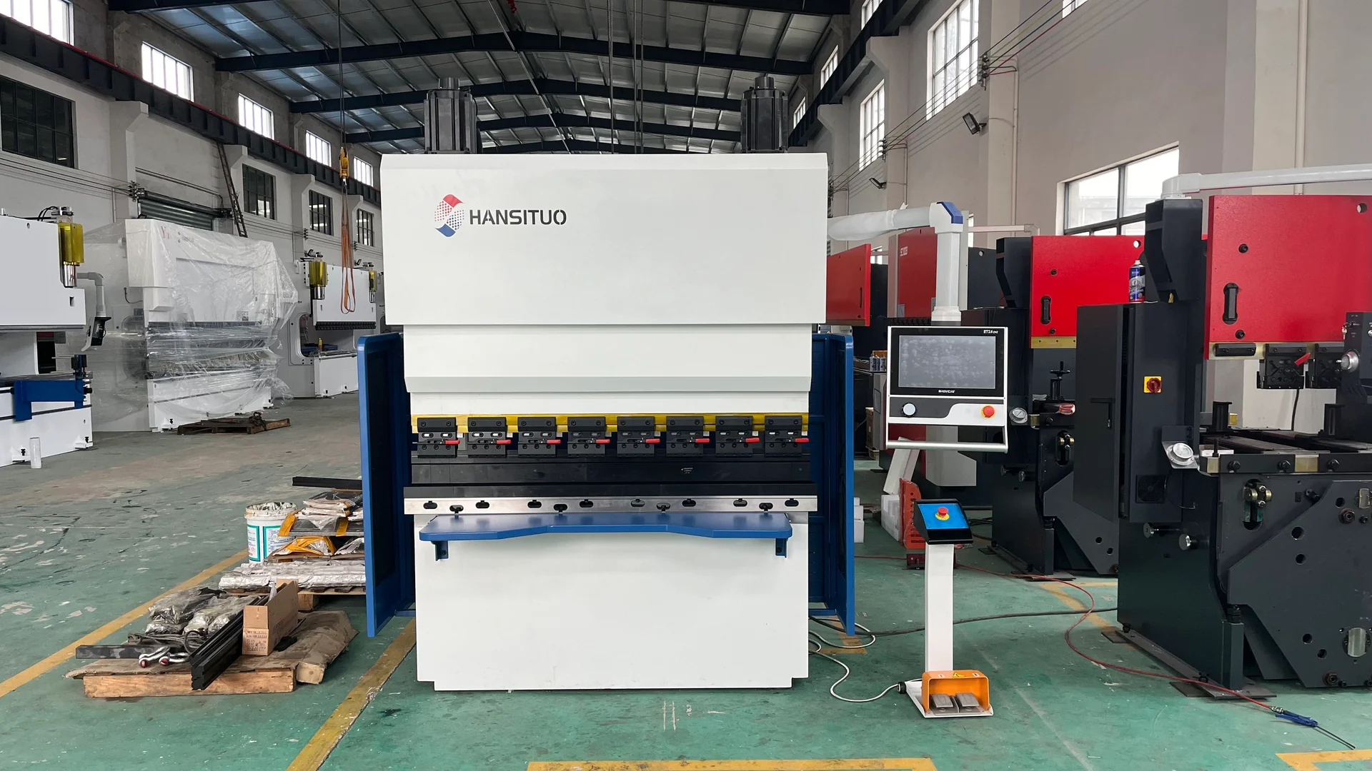 Compact HANSITUO electric press brake with visible upper drive motors and front supports.