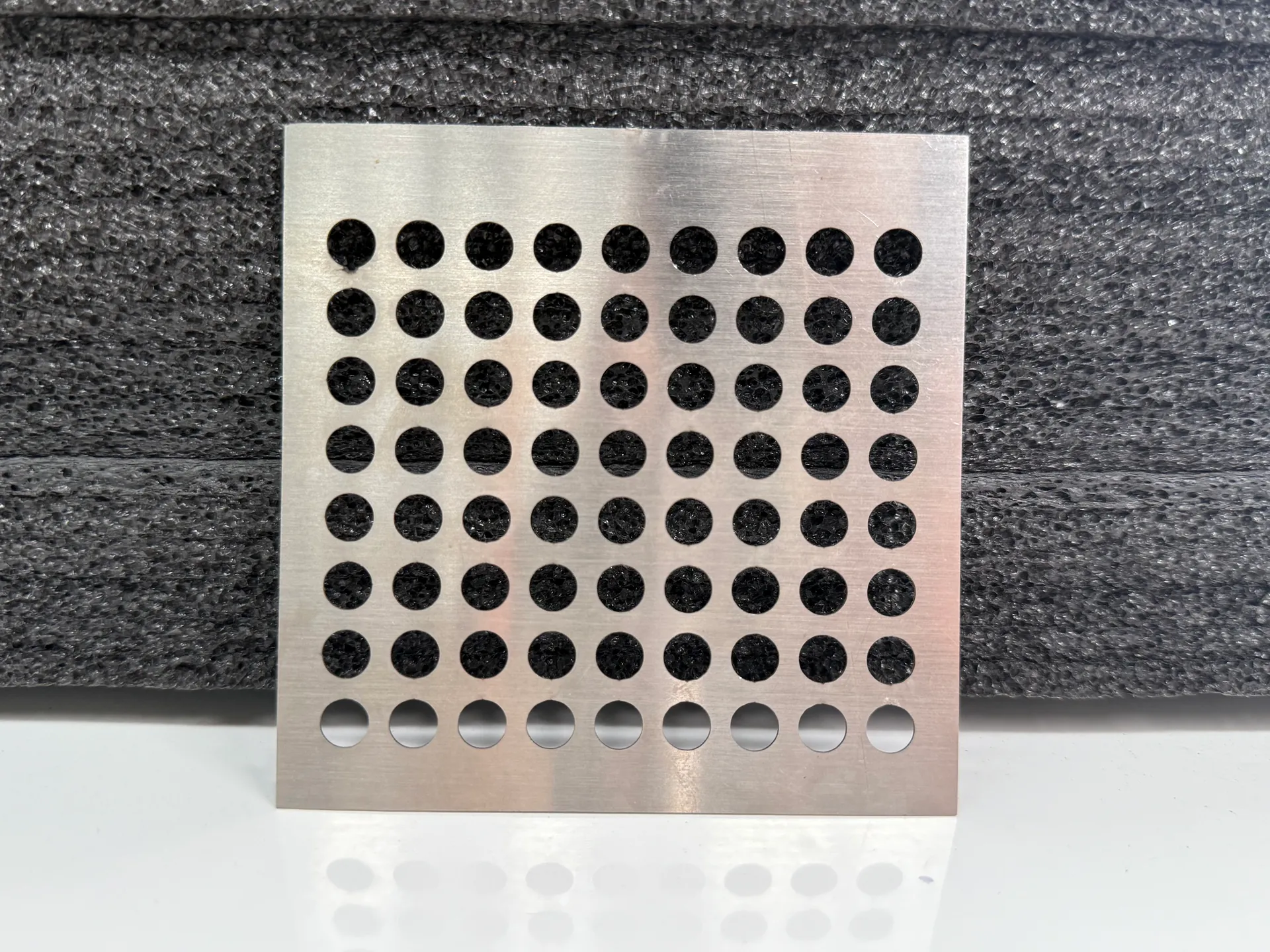 Metal sheet sample with a regular array of circular holes