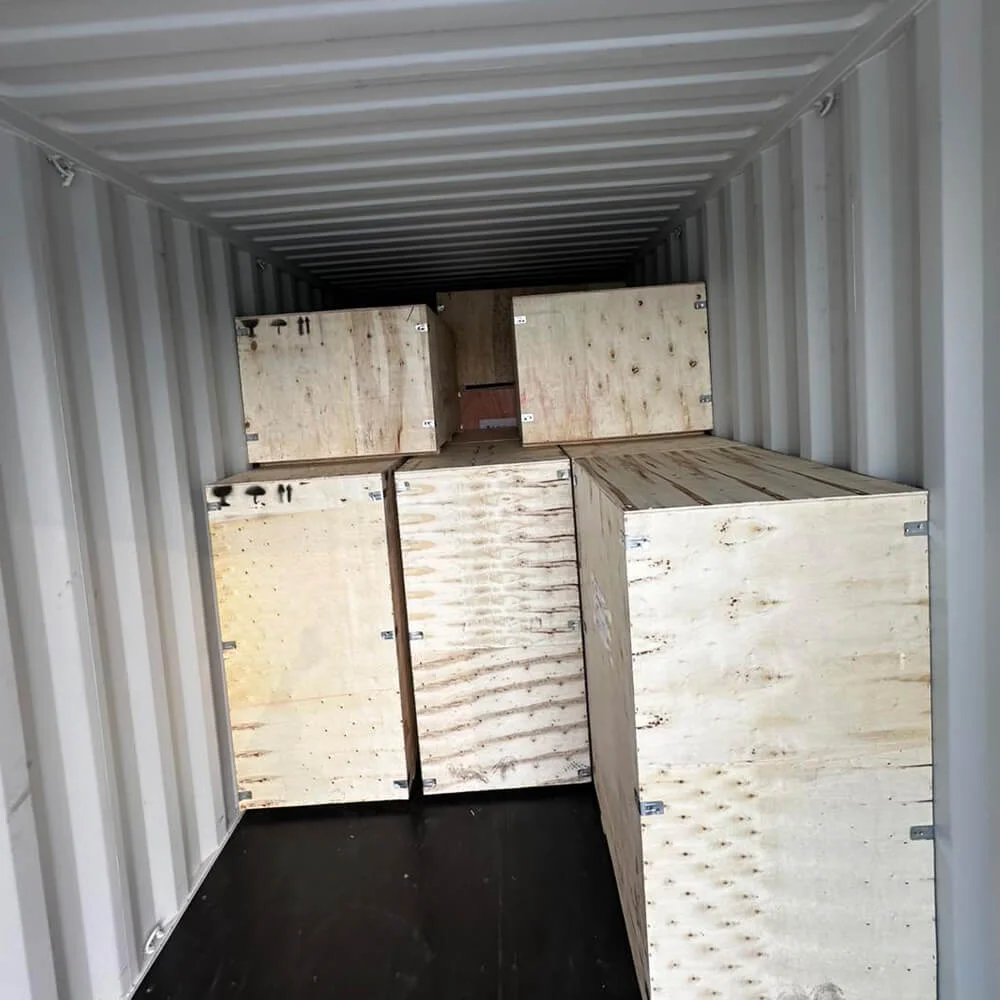 Identified wooden crates in a shipping container; reference