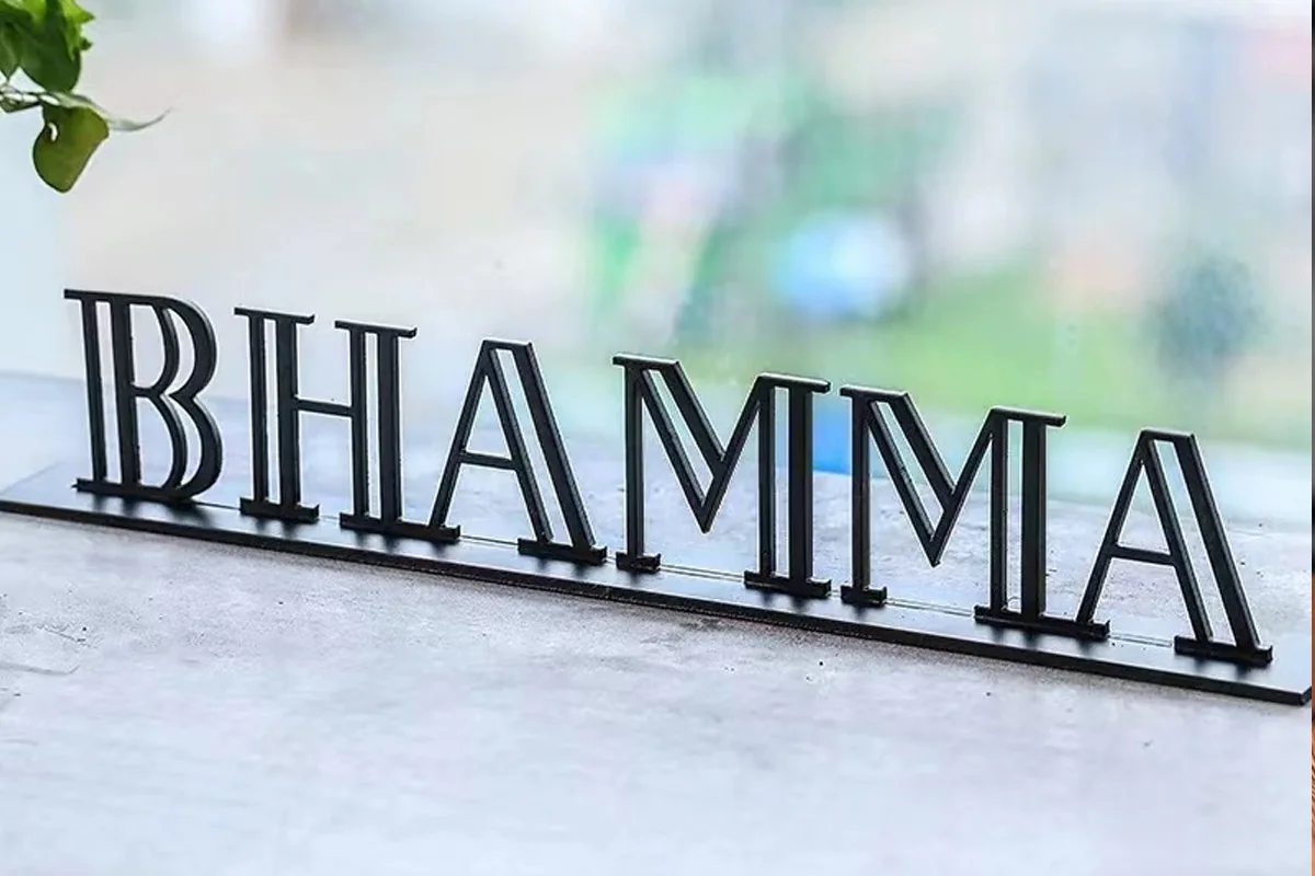 Freestanding fabricated metal display lettering; reference