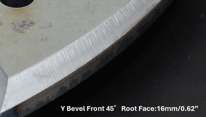 Third-party close-up photograph of a plate edge with an angled bevel face and retained root face