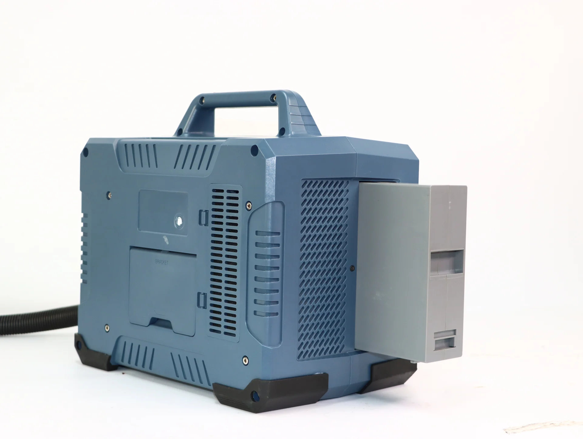 Rear view of a portable laser marking unit with a carrying handle and ventilation grilles.