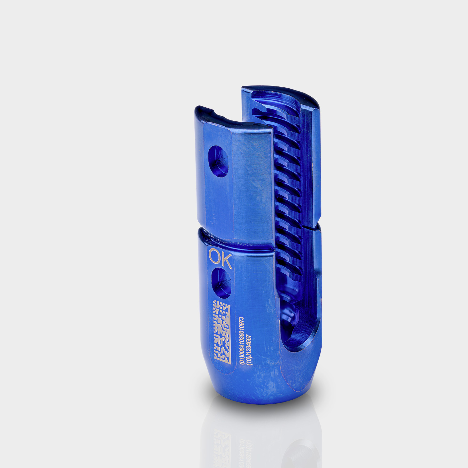 Laser-marked DataMatrix and human-readable identification on a blue-finished aluminum component