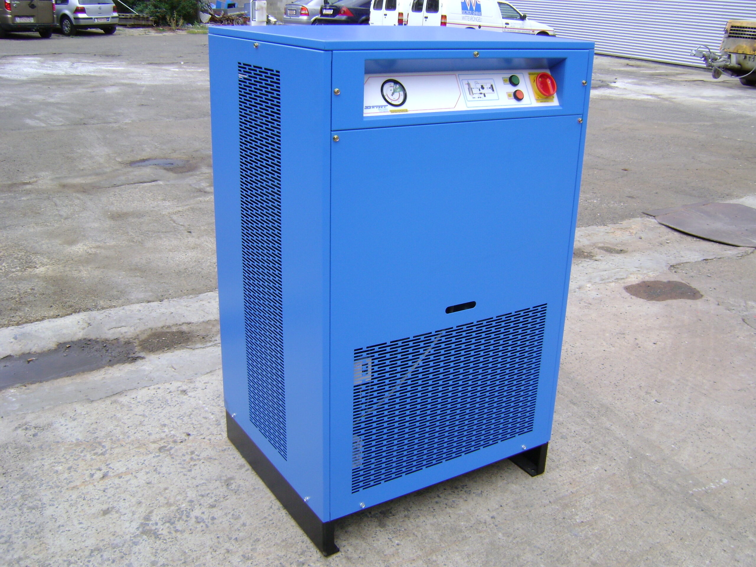 Blue refrigerated compressed-air dryer photographed outdoors