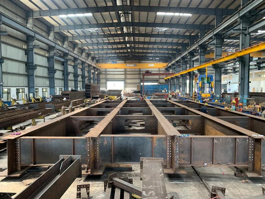 Structural steel assembly hall with overhead handling; industry reference