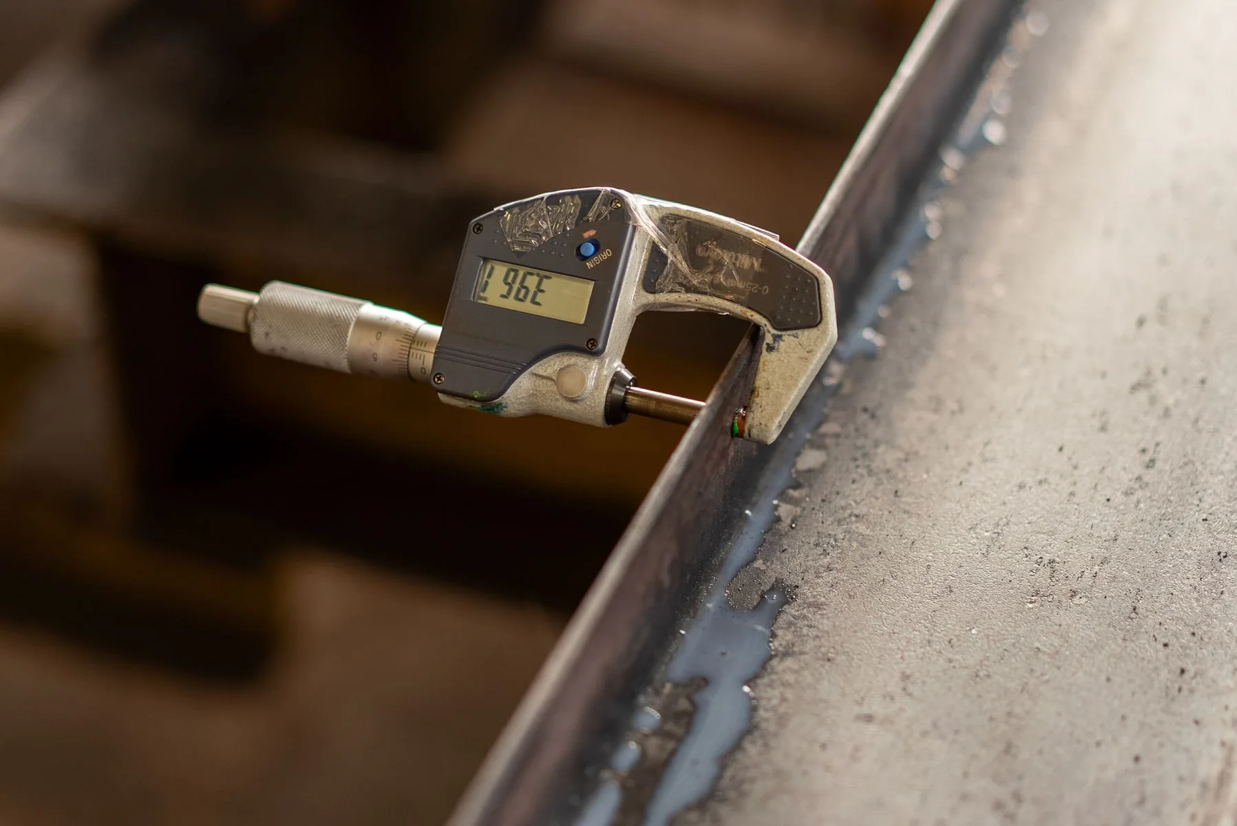 Measuring metal thickness with a digital micrometer; reference