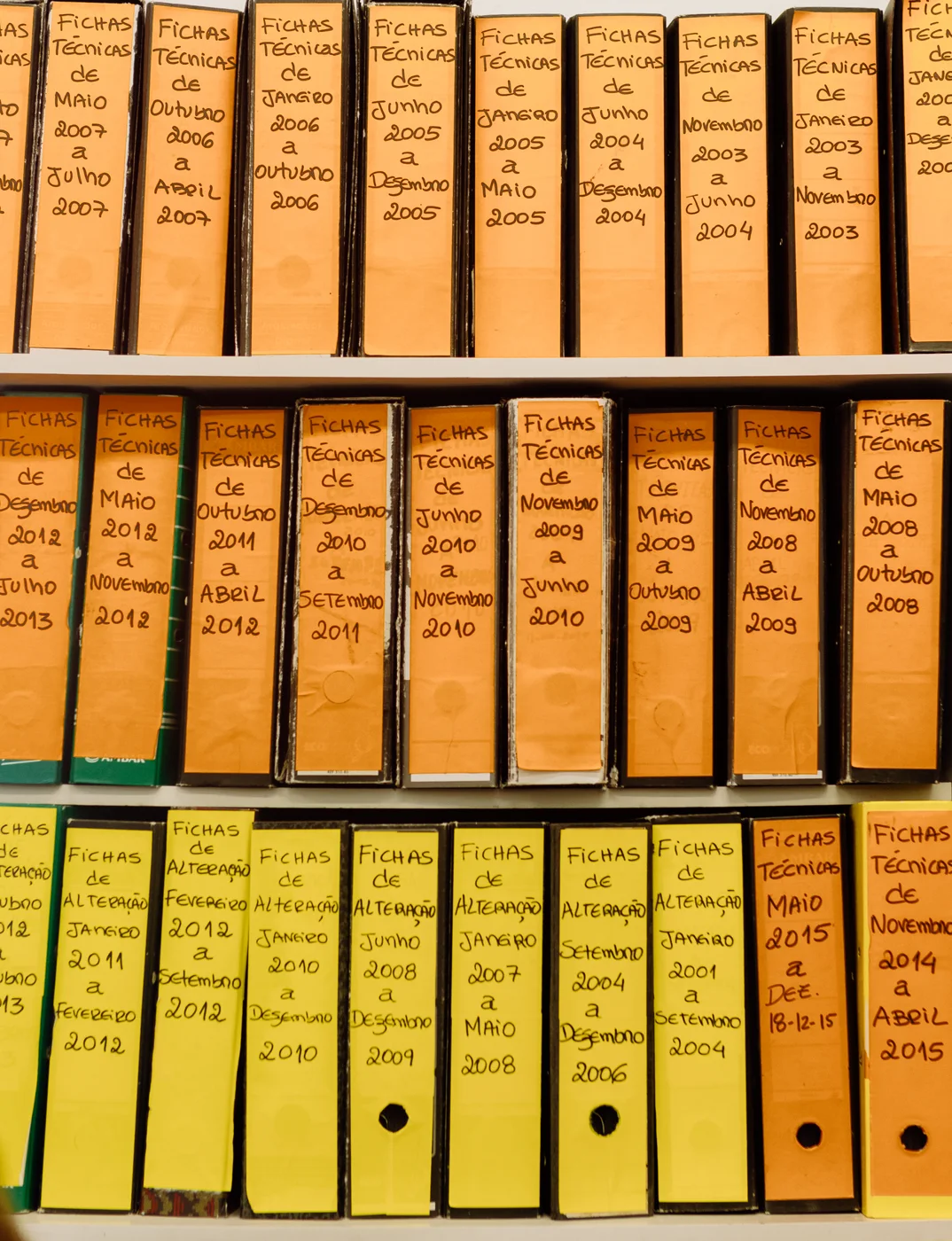 Dated technical-document binders on shelves; archival reference