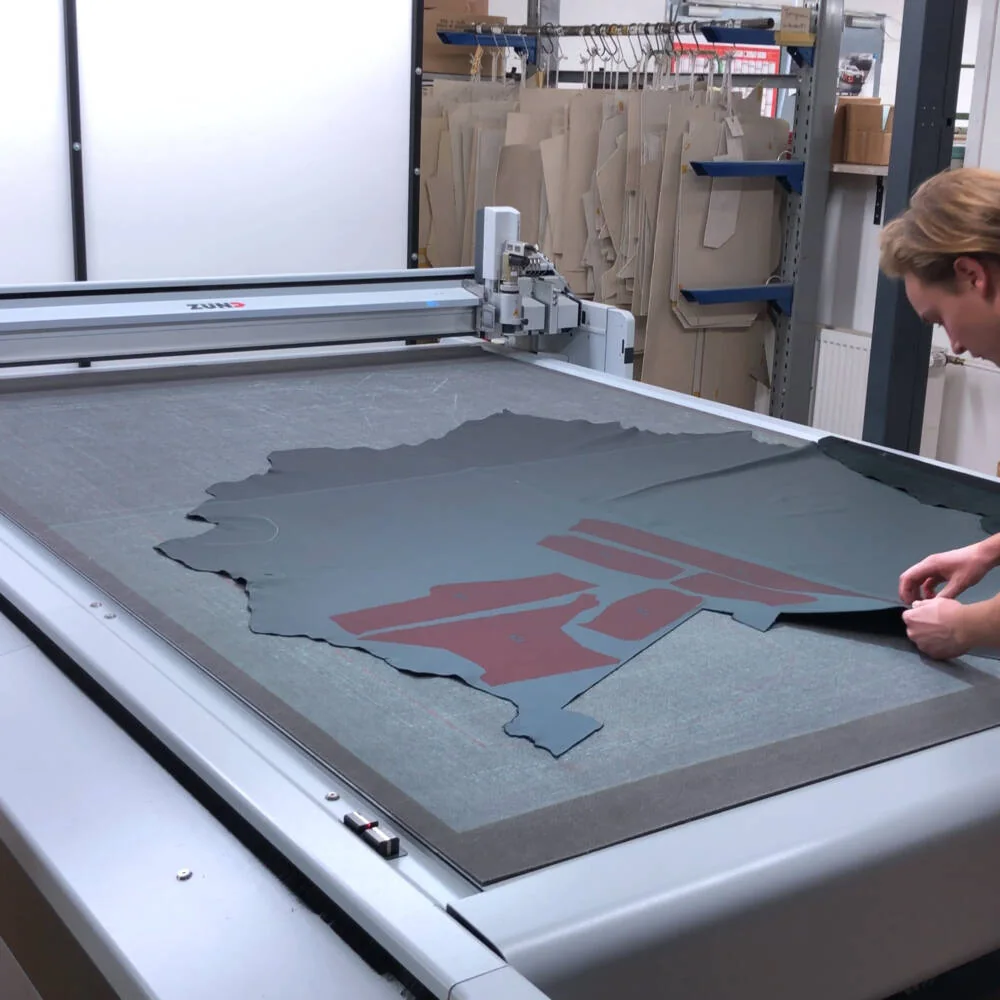 Collecting cut upholstery patterns from a digital cutting table; industry reference